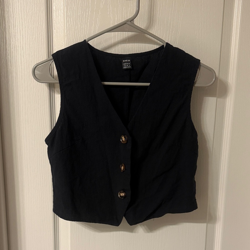 Black Sleeveless Blouse with Button Detail